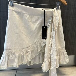 NWT Greylin Cream white wrap tie mini skirt w/Pom trim & ruffle hem size XS